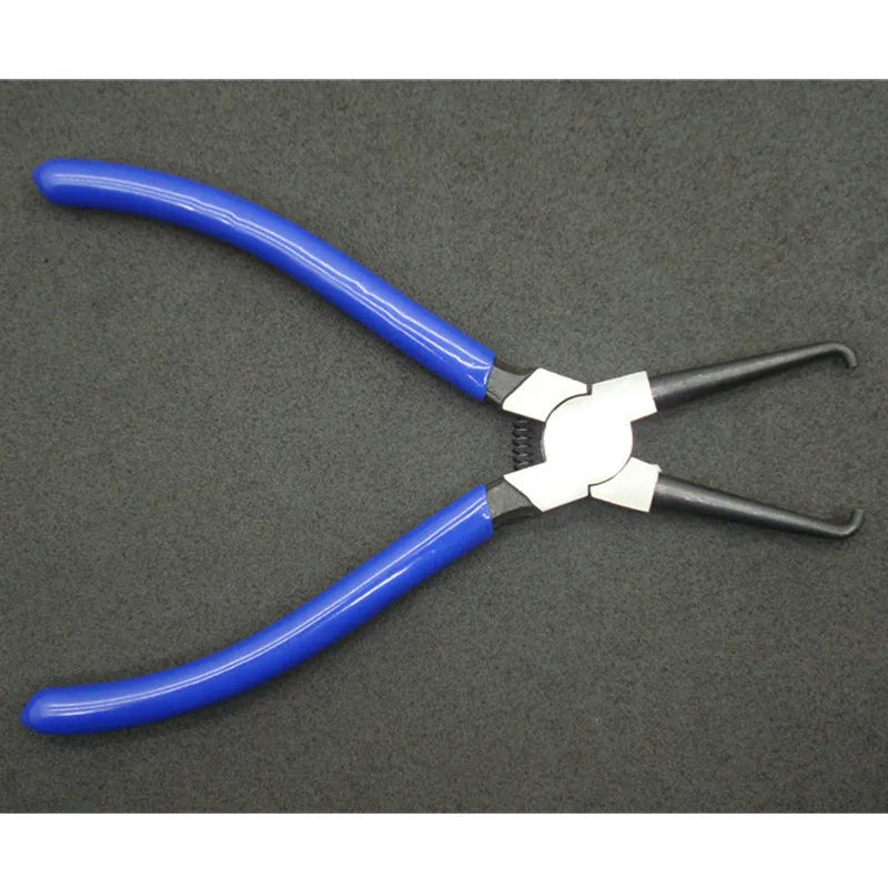Iron and rubber caliper tubing pliers for automotive fuel line maintenance.