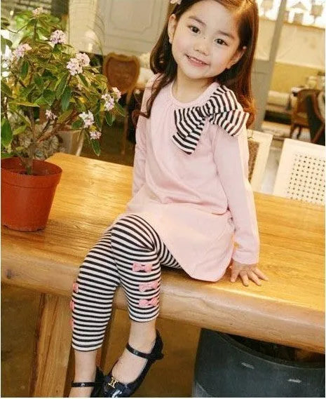 Pink cotton clothing set for girls showing coordinated pieces in children's sizes