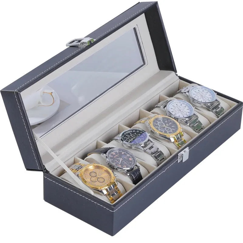 Grey high-grade leather watch storage box with a clear, dustproof lid on a table.