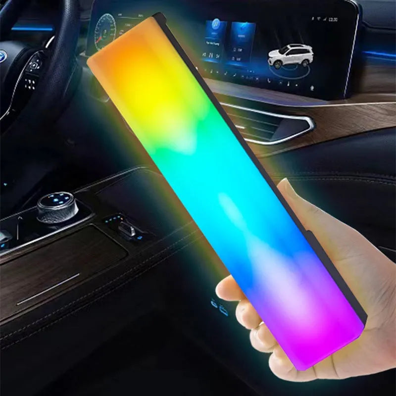 Black and white 3D RGB voice-activated music rhythm ambiance lamp on a table.