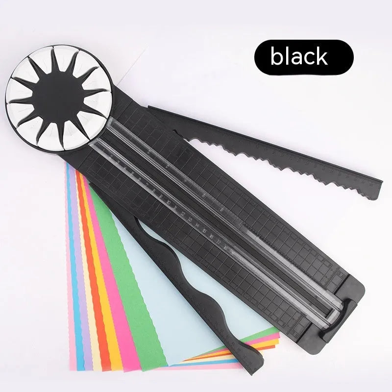 Pink 12-in-1 paper cutting machine with interchangeable blades for scrapbooking on white background