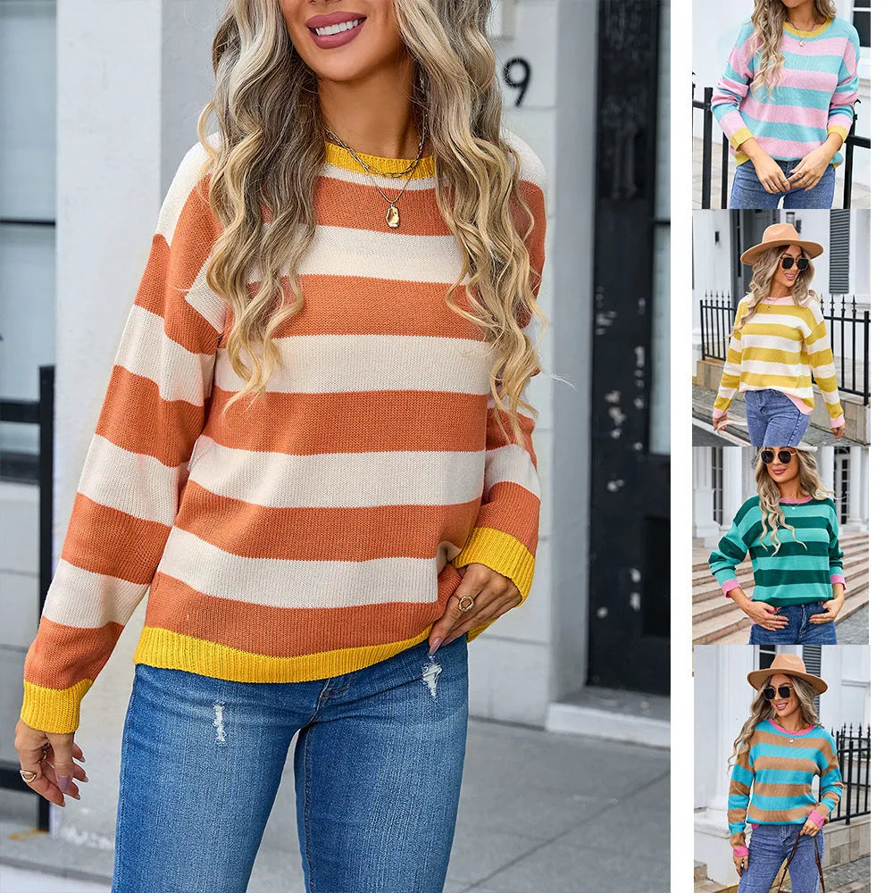 Women's loose fit long sleeve striped sweater in blue colour on a hanger.