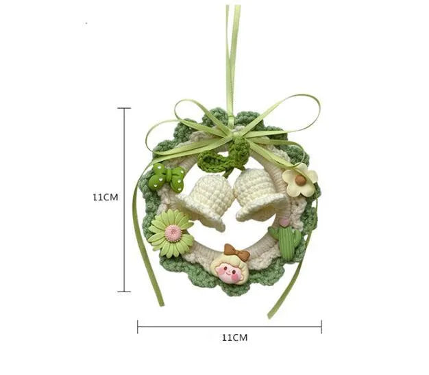 Hand-woven wool bell orchid car pendant in green, pink, purple, and yellow colour variations