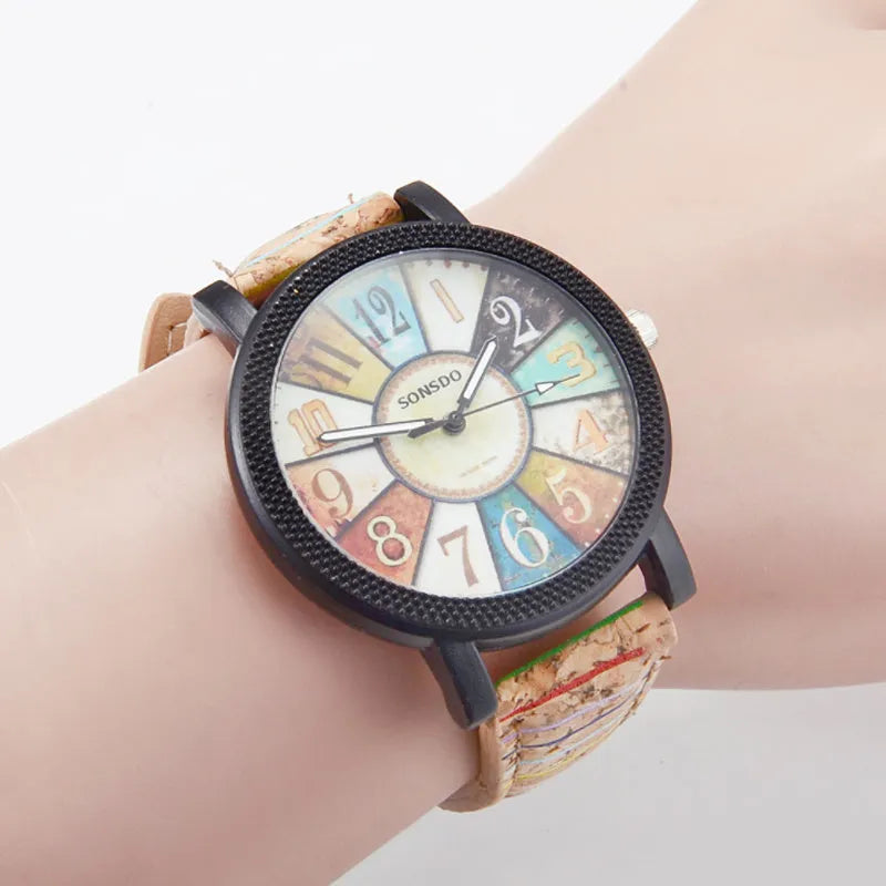 Women's vintage-style quartz watch with brown leather strap and silver round 37mm dial.