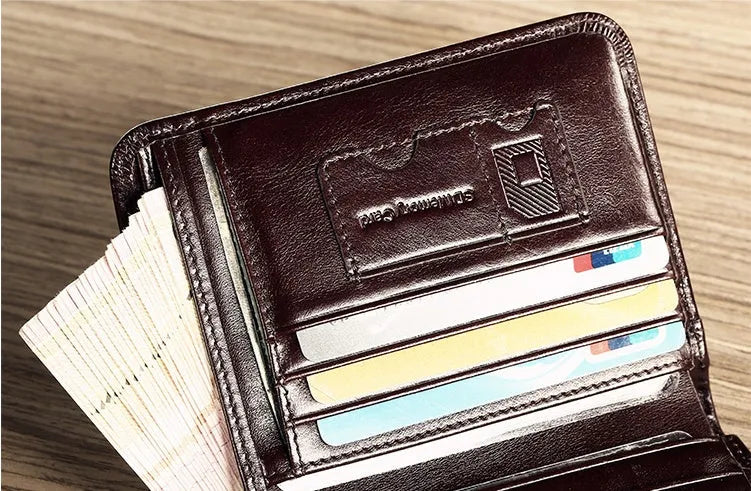 Men's leather wallet open showing photo window, card slots, coin pocket, and banknote compartment.