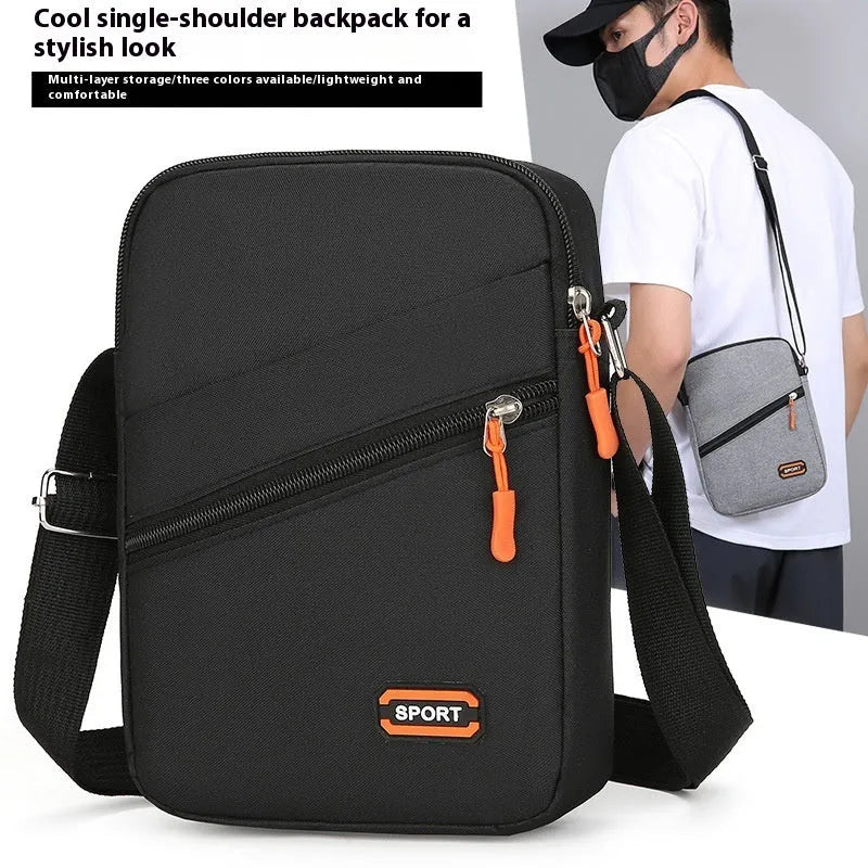 Ultra-light Oxford cloth crossbody commuter bag in black, navy blue, or silver grey with contrast colour detailing.