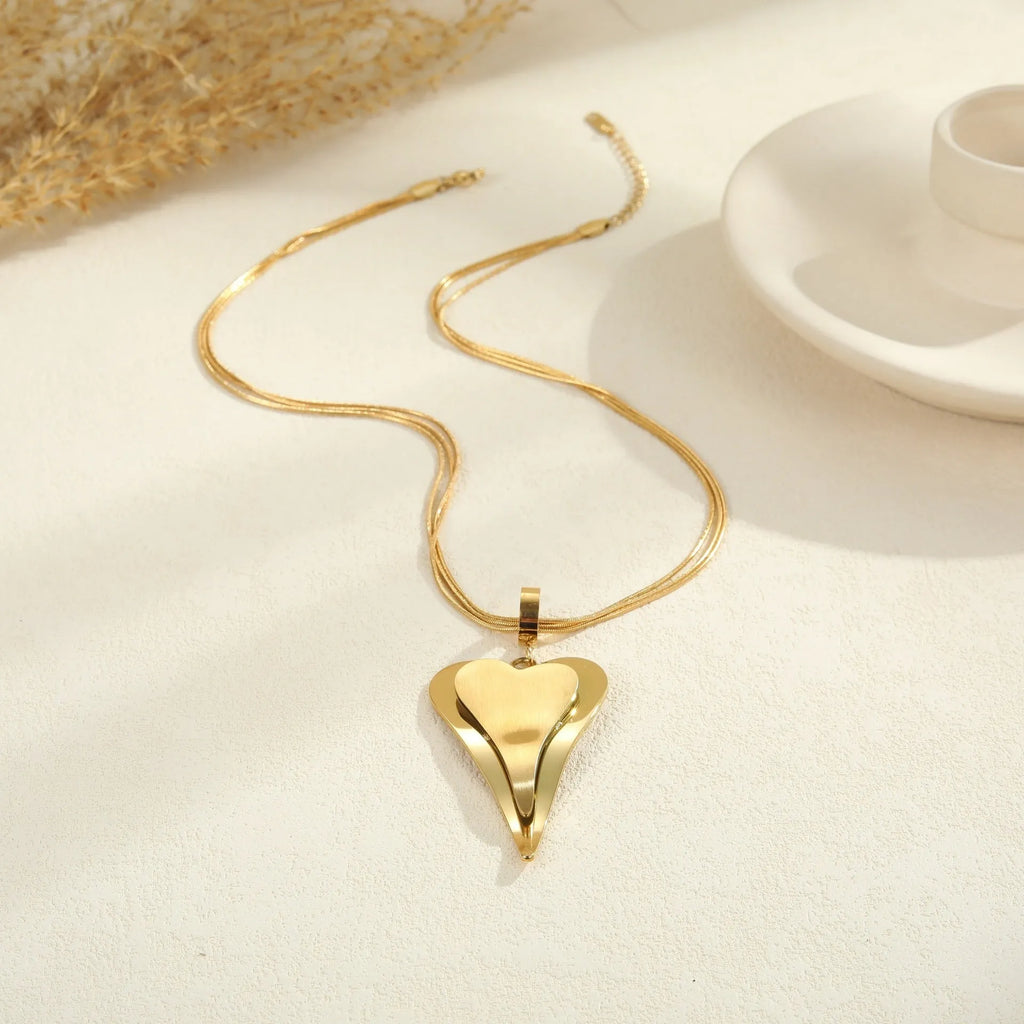 Geometric double heart pendant necklace with snake bones chain in gold or steel finish