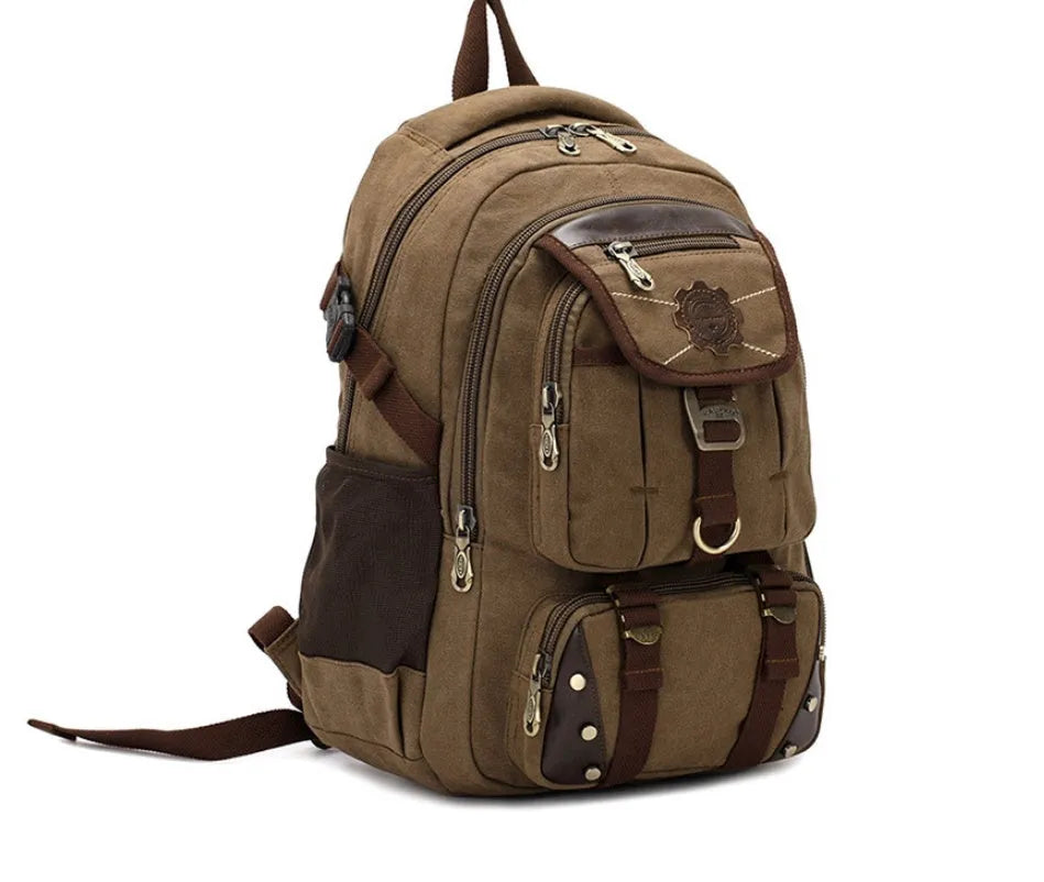 Large canvas computer backpack in military green with car stitching and top handle