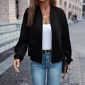 Black women's casual zip jacket with long sleeves and faux pockets on a model.