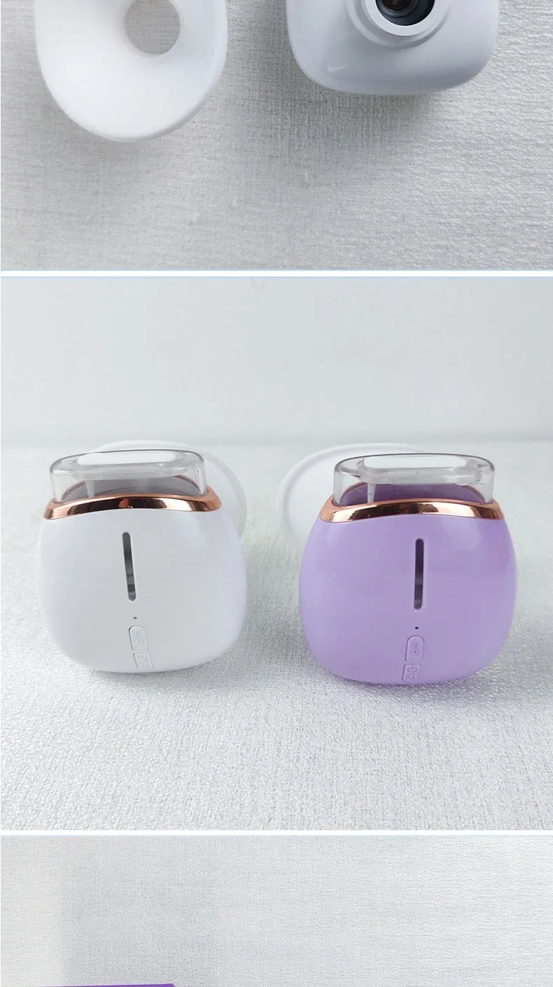White and purple portable eye humidifier device with USB charging cable on white background