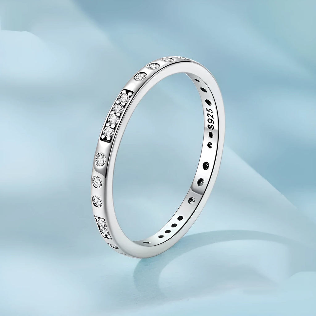 Silver ring with oxidised black moss texture and I Love You engraving on band.