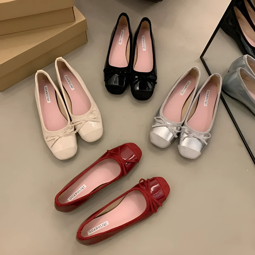Retro apricot colour Mary Jane ballet flats with bow detail and square toe on a white background.