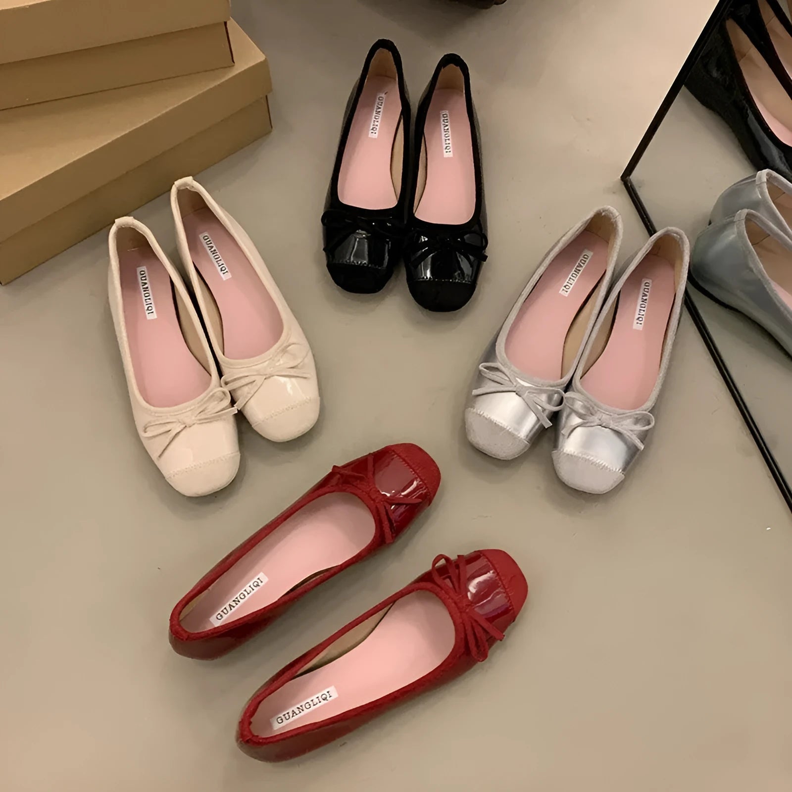 Retro apricot colour Mary Jane ballet flats with bow detail and square toe on a white background.
