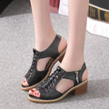 Women's retro sandals with a side zip in black, creamy white or white colours on a mid-heel.