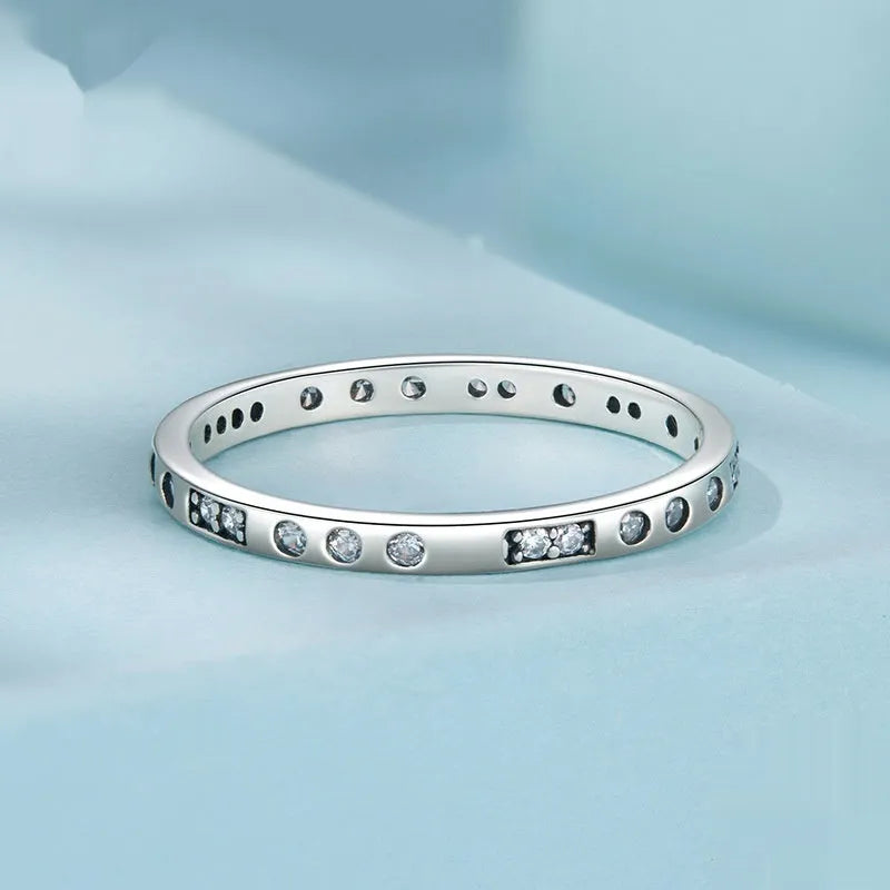 Silver ring with oxidised black moss texture and I Love You engraving on band.