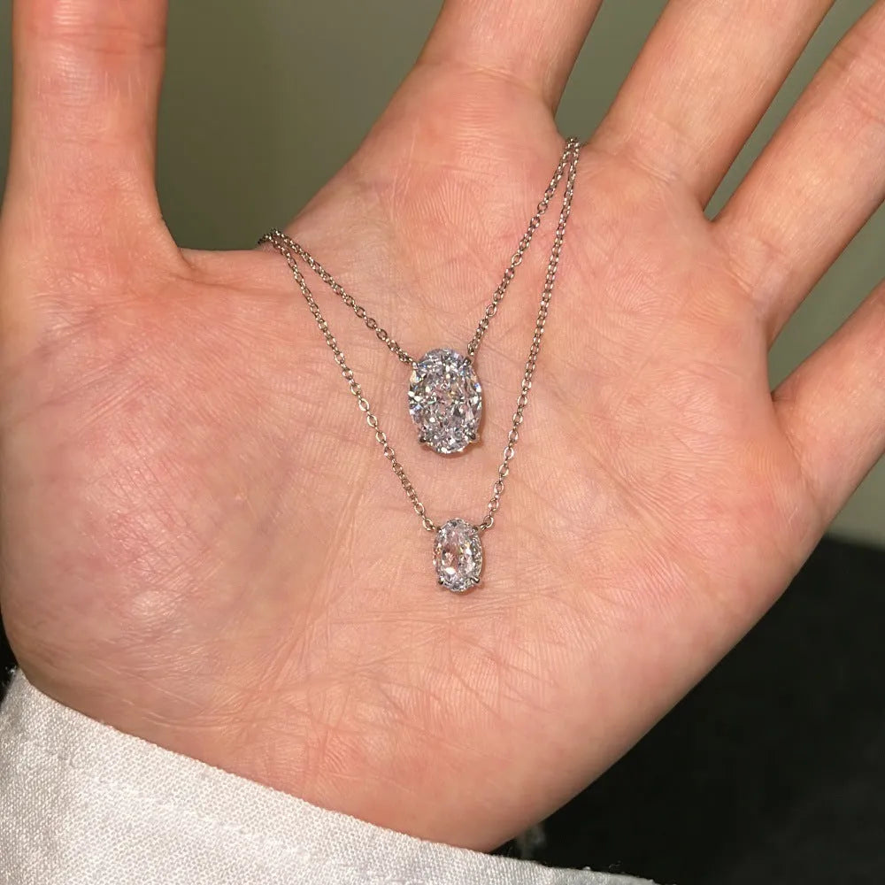 Women's sterling silver necklace with a small geometric oval ice flower pendant.