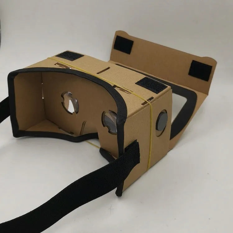 Pink and white foldable VR Cardboard viewer headset for 6-inch smartphones with head strap.