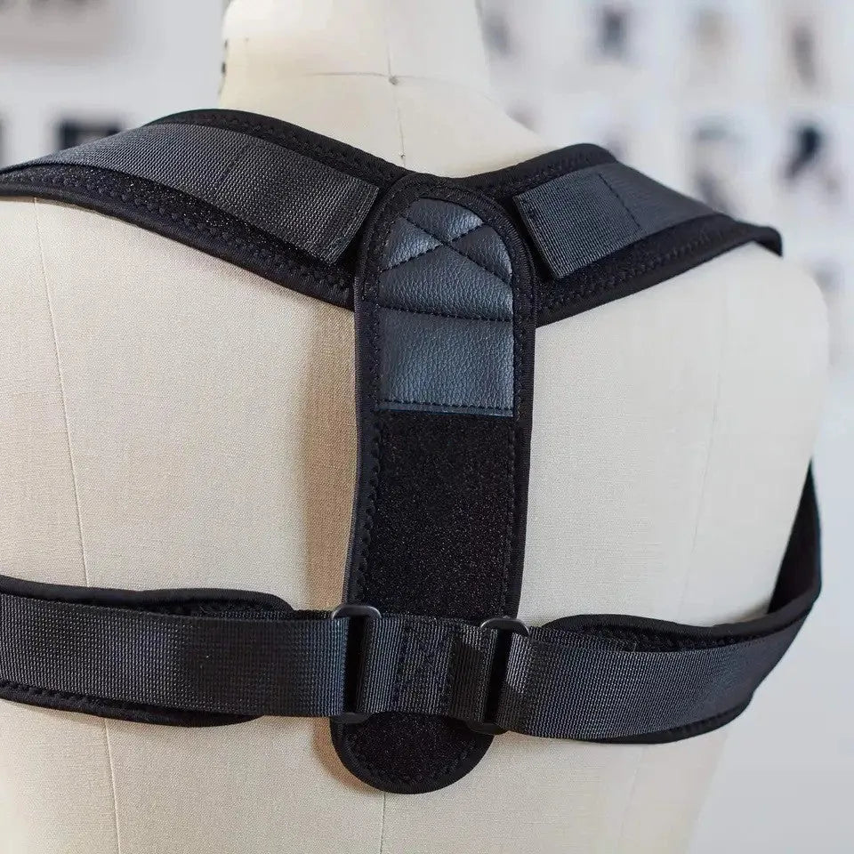 Black elastic adjustable posture correction strap laid flat on a white background.