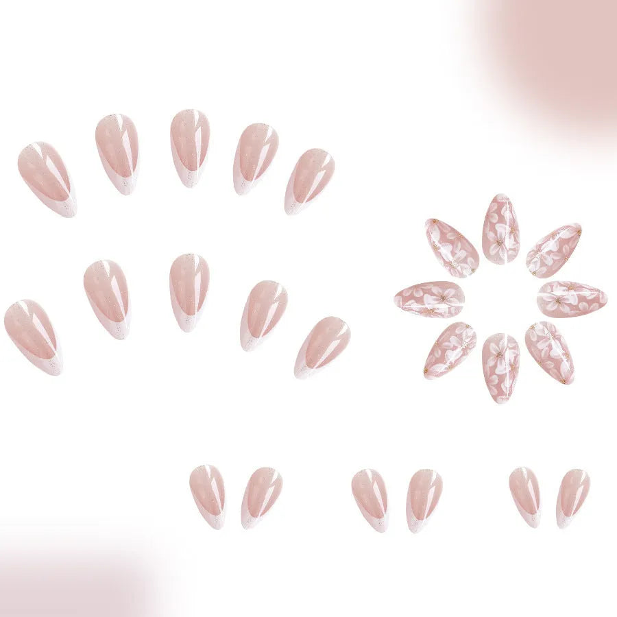 Short almond French manicure press-on nails with pink glitter finish and floral designs