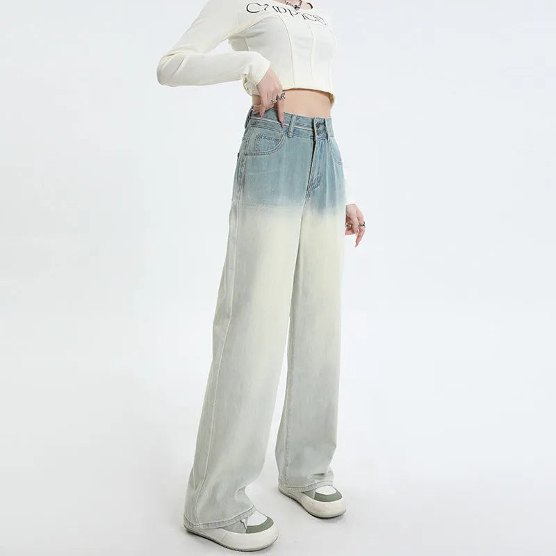 Women's gradient blue straight-leg denim trousers showing wider cut through thigh and calf