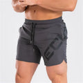 Men's knee-length quick-dry nylon sports shorts in black with elastic mid-waist