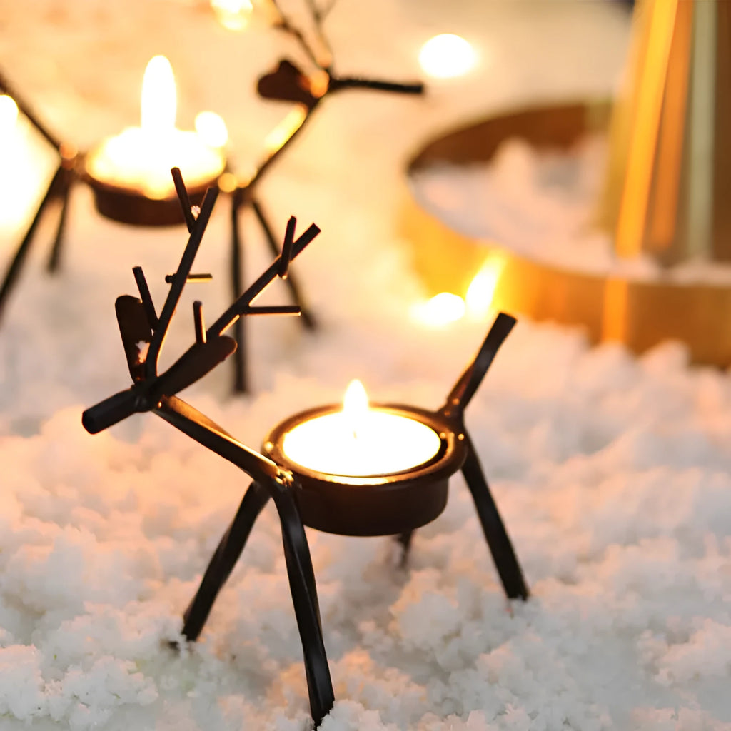 Black iron Christmas deer candlestick holder with elk bracket and festive motifs.