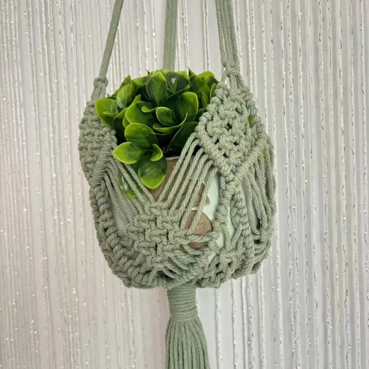 Hand-woven minimalist flower pot in raw cotton colour with an external net pocket for tools.
