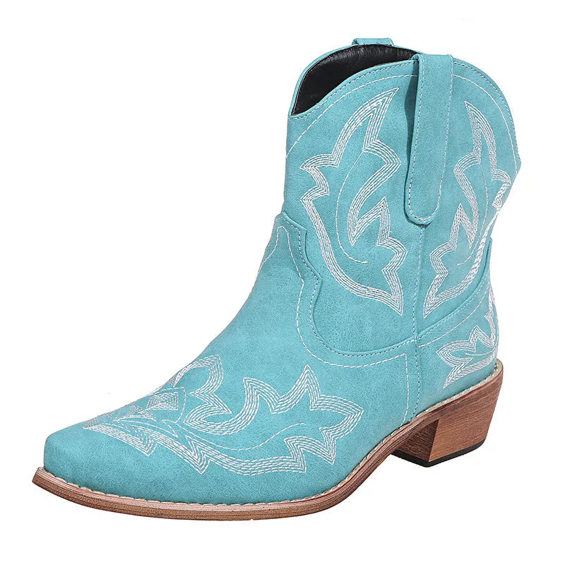 Blue women's cowboy boots with embroidered detail, a low wedge heel, and a pointed toe.