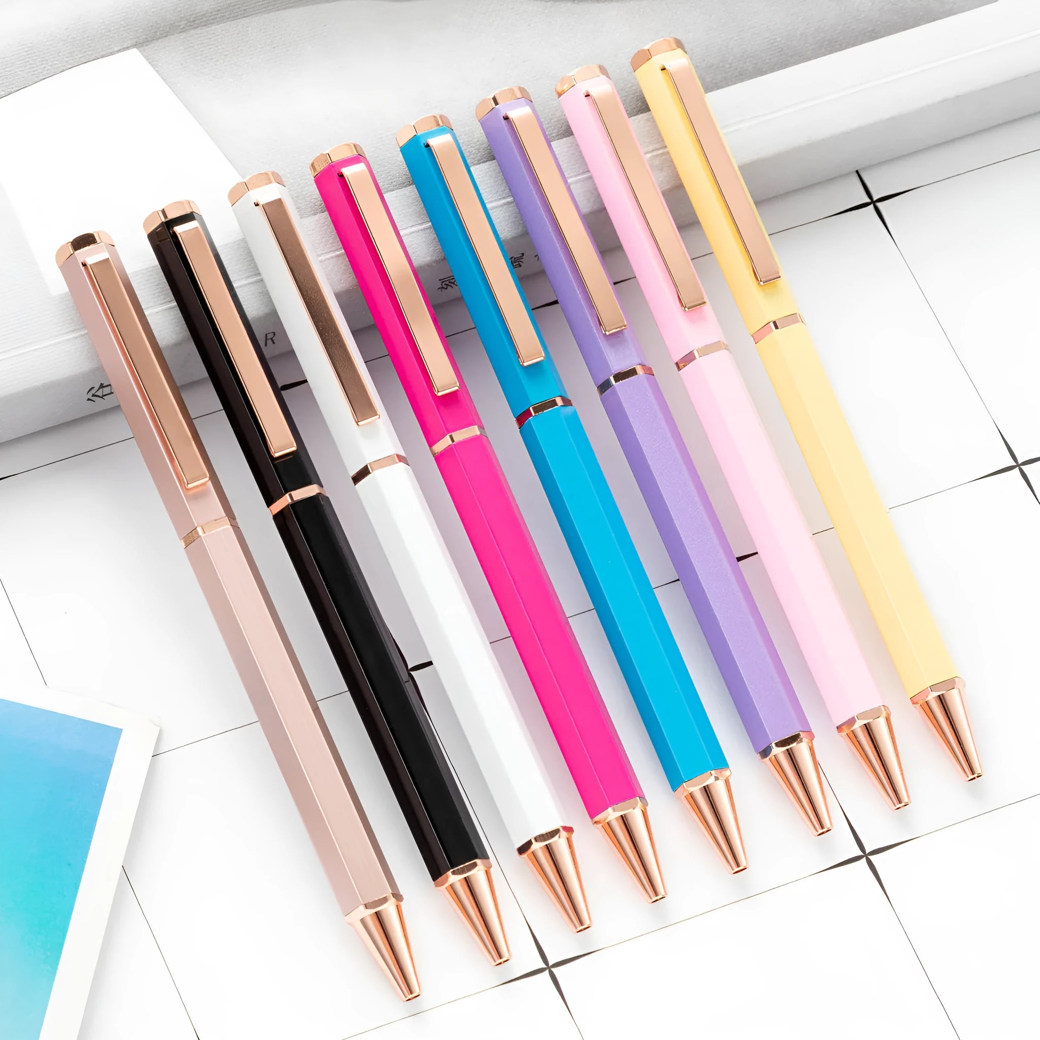 Metal ballpoint pen with six-angle rod body and bullet tip in black colour on white background
