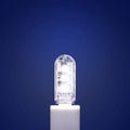 Small white USB rechargeable baby night light showing white and warm light glow options.