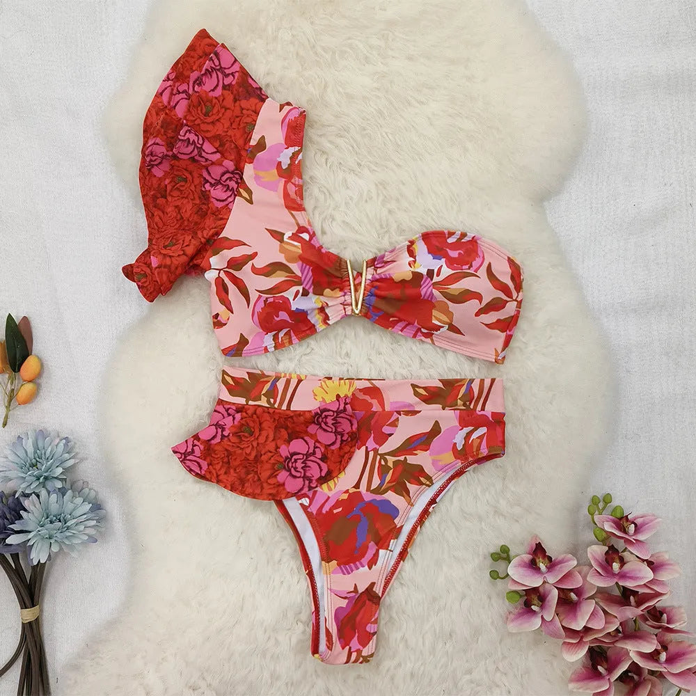 Women's one-shoulder ruffled floral print bikini set with high-waisted briefs in pink and red colours