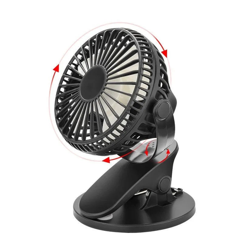 A white portable clip fan with plastic blades, showing its USB charging port and piano button switch.