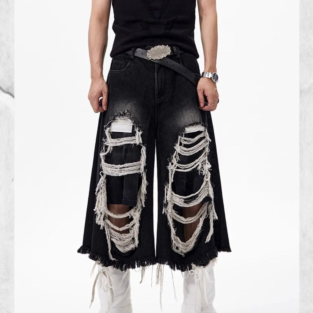 Black women's cropped wide-leg jeans with mid-high waist and ripped patch detail