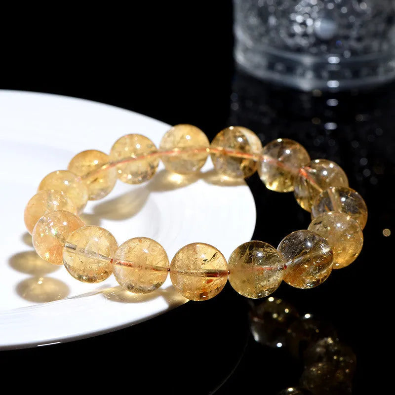 Natural yellow citrine bracelet with Asestelle beads in Brazilian yellow or violent yellow colour options.