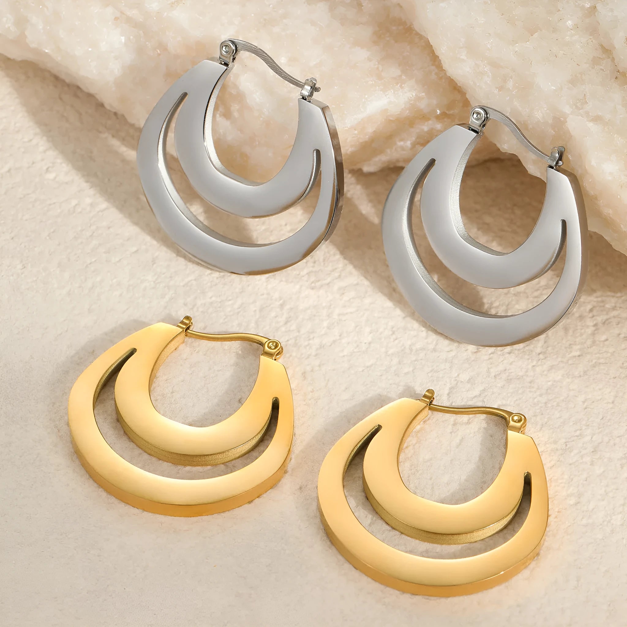Geometric French earrings with round ring elements in gold and steel colour options