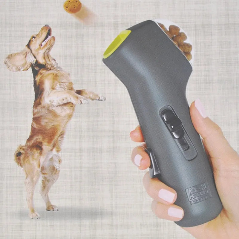 Grey plastic dog training toy with snack catapult launcher showing 18cm portable design