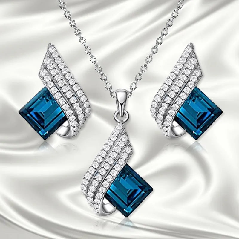 Women's necklace and earring set with glass pendant on cross chain necklace