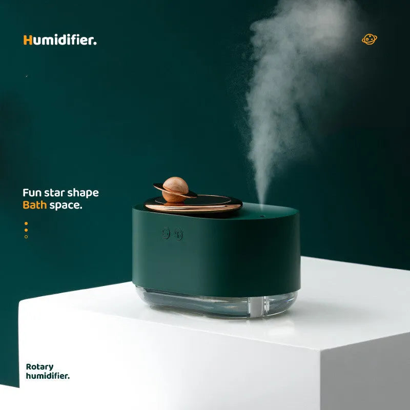 Rotating planet-shaped USB car humidifier in white with night light on, showing compact size.