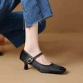 Women's black square toe stiletto heel ankle-strap shoes with a horse hair upper.