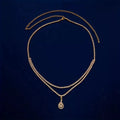 Gold waist chain with water drop pendant and rhinestone details, showing lobster clasp closure