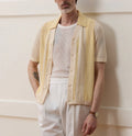 Yellow asymmetrical Tencel polo shirt with hollow-out detailing and short sleeves