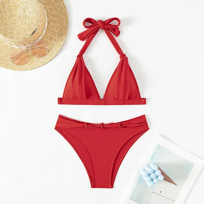 Red women's halterneck bikini with lace-up front closure and adjustable tie sides