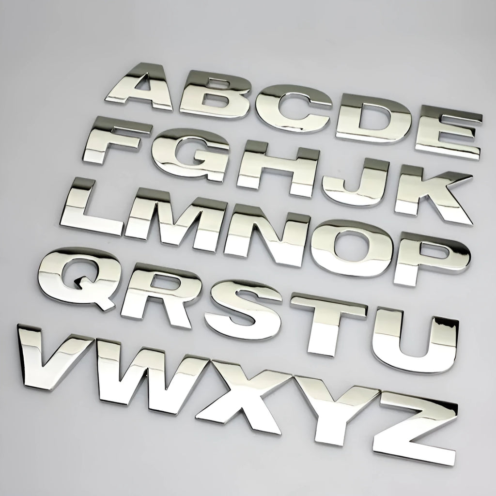 3D metal car letter stickers showing raised zinc alloy characters in black and silver finishes