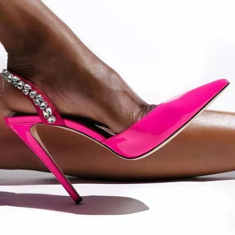 Women's black pointed toe high heel sandals with rhinestone decoration on the side.