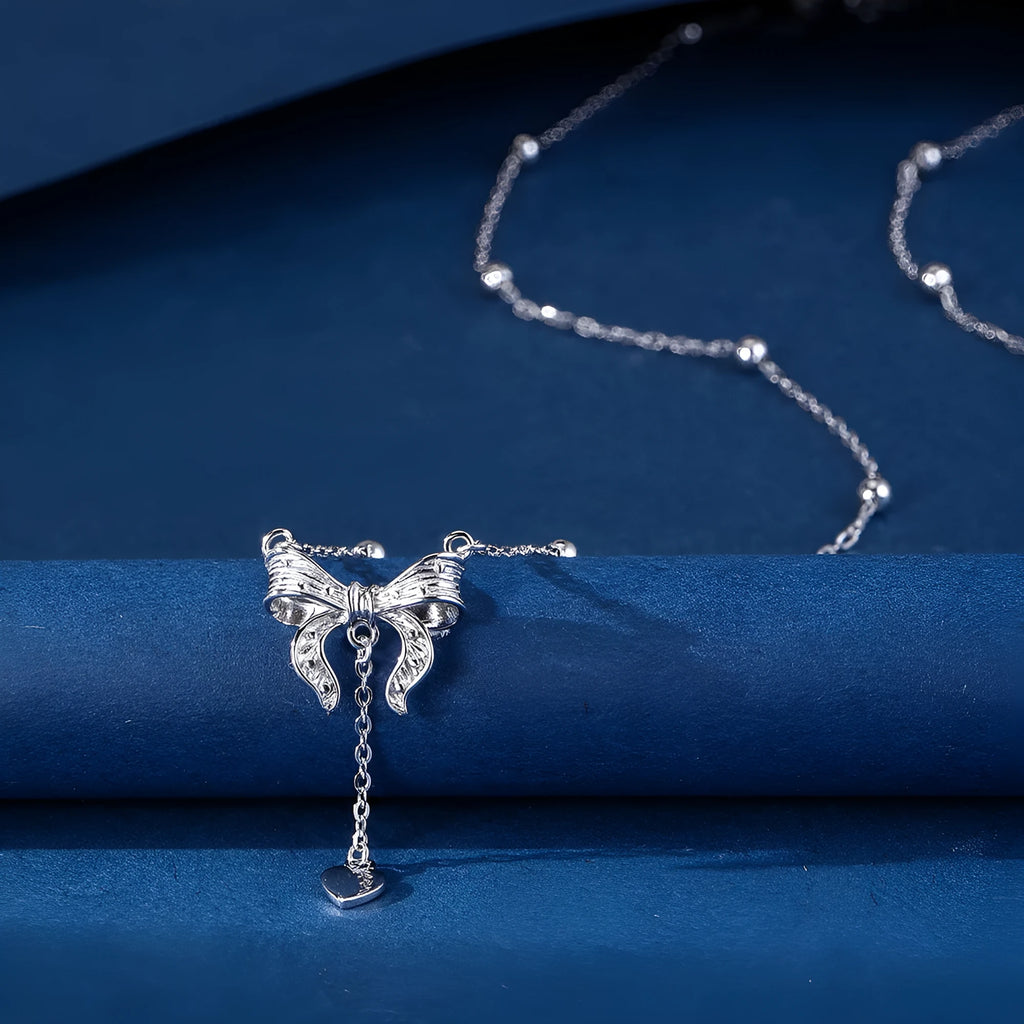 S925 silver necklace with heart-shaped pendant featuring butterfly and bow design on adjustable O-ring chain