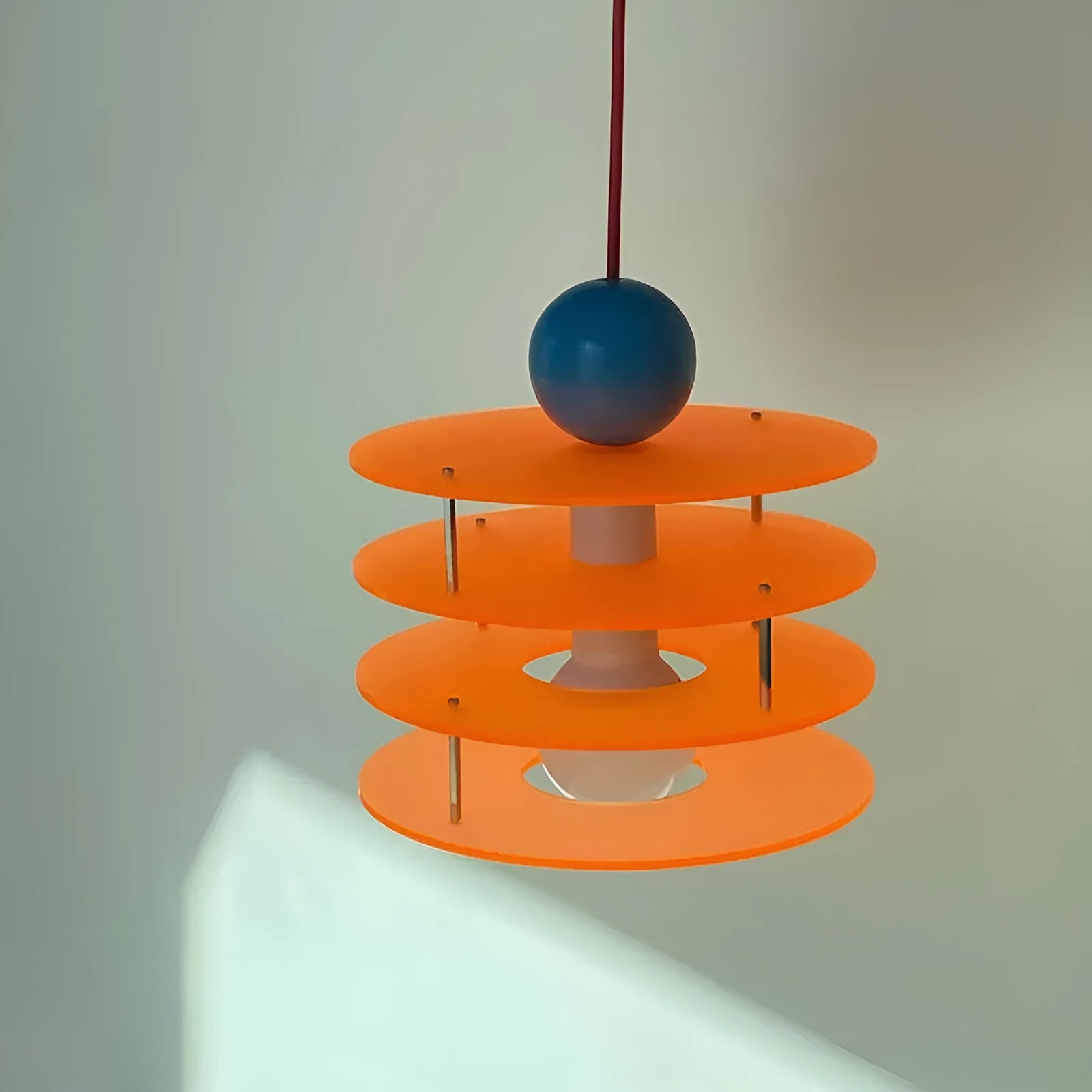 Modern Macaron PH5 adjustable chandelier with frosted glass shade in choice of white, blue, or orange.