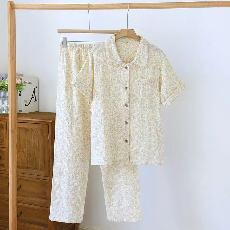 Washed cotton short-sleeved top and trousers set in a floral or plaid pattern, laid flat.