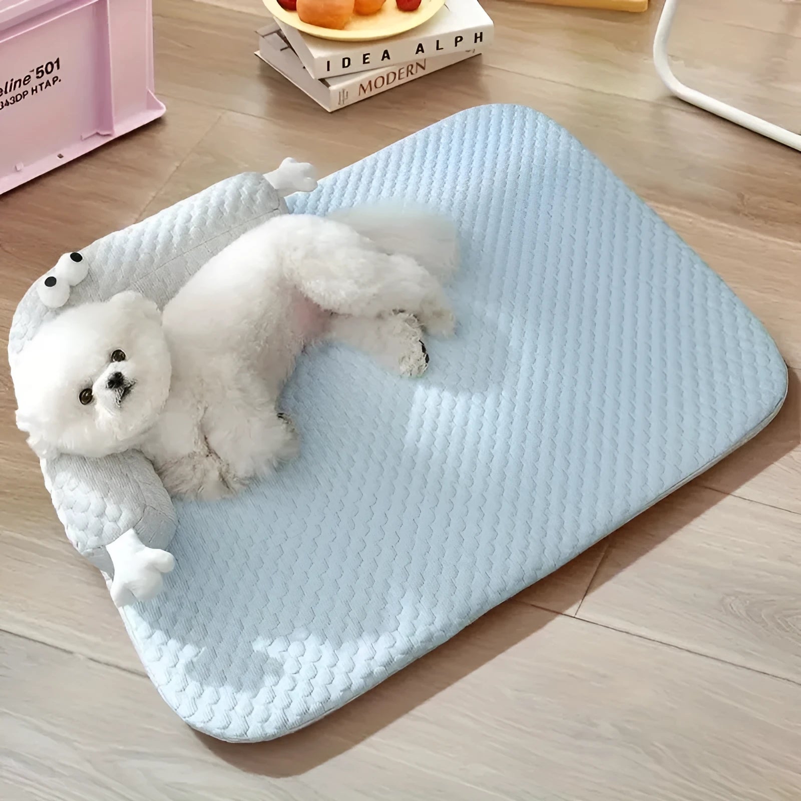 Blue monster design non-slip pet cooling bed for large dogs on a wooden floor.