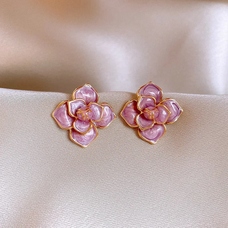 Gold plated purple oil-spot glaze flower stud earrings with copper construction and fresh floral design