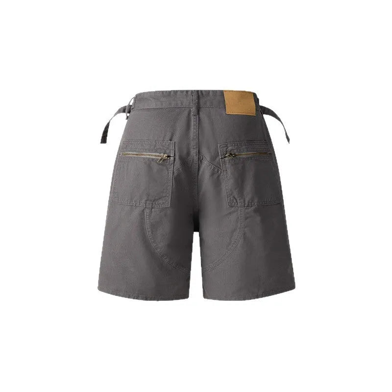 Retro washed cotton workwear shorts in loose fit with zipper, shown in grey, green, camouflage, and blue colour options.